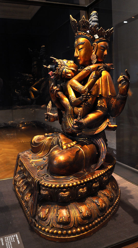 A golden bronze Tibetan statue of a couple in sacred sexual union A golden bronze Tibetan statue of a couple in sacred sexual union