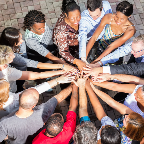 People with their hands in a circle