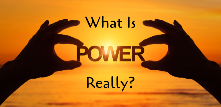 What is Power, Really? Fingers holding the word Power, with golden sun in background